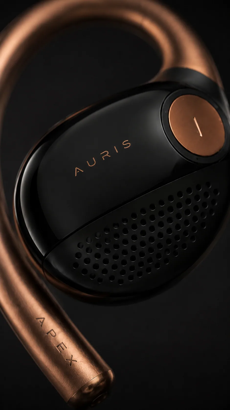 Close-up of the Auris audio wearable with copper loop and black body