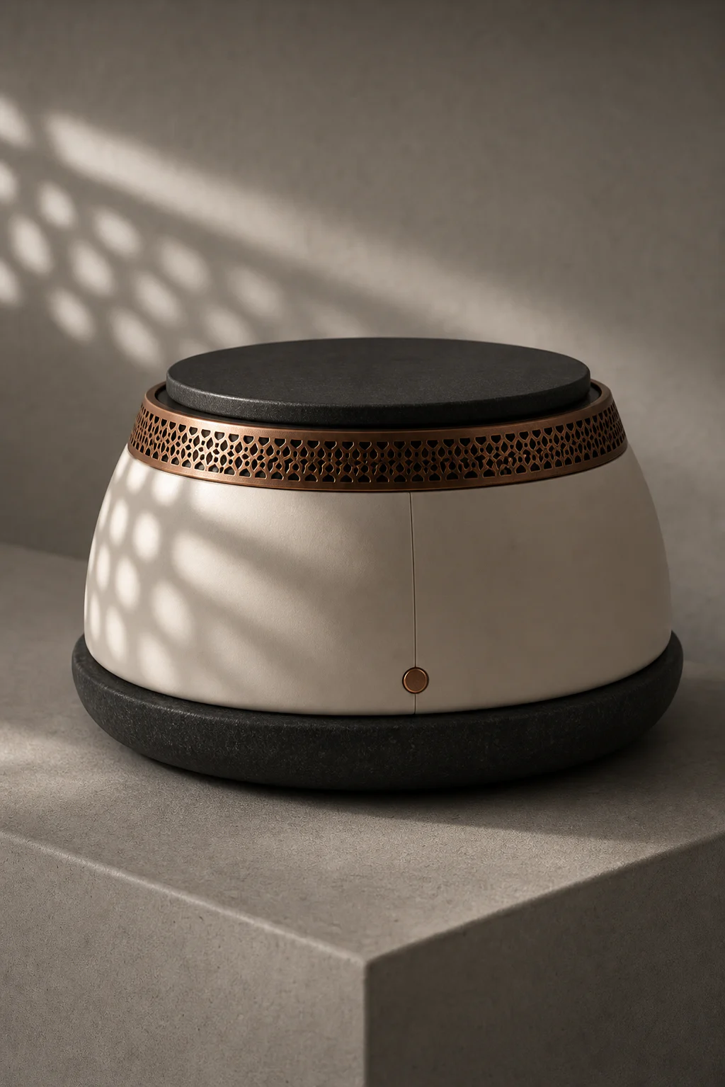 Aged-copper perforations on EMBERA Qamar One casting a geometric warm shadow