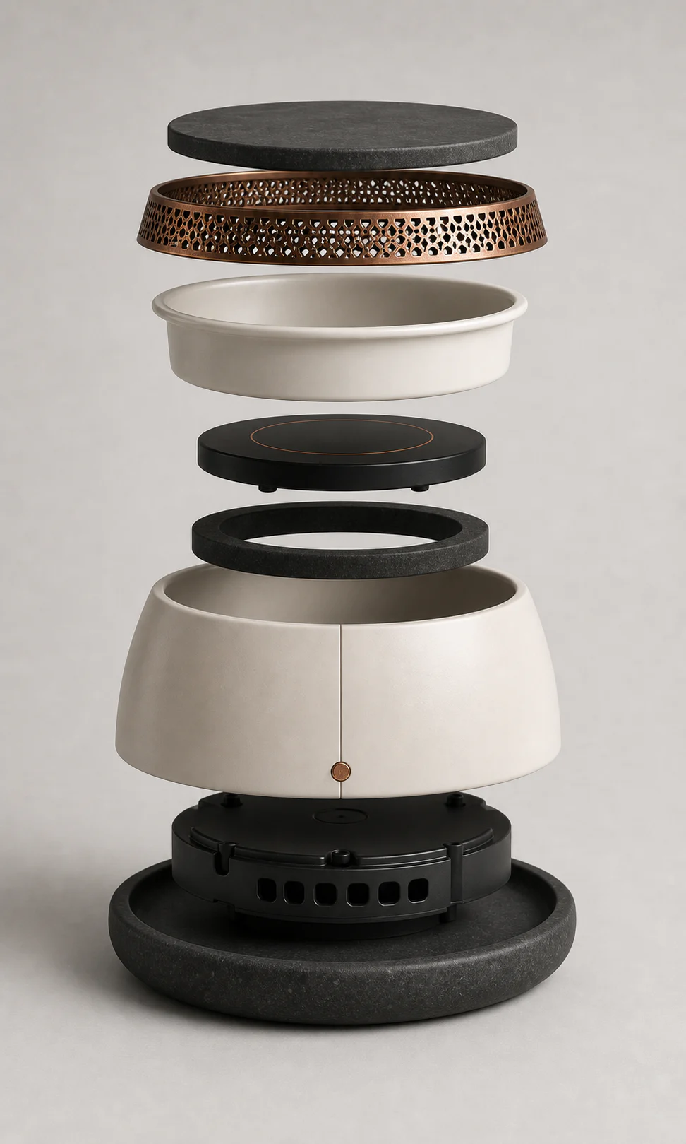 Exploded view of EMBERA Qamar One showing basalt lid, aroma chamber, porcelain body, and warming plate