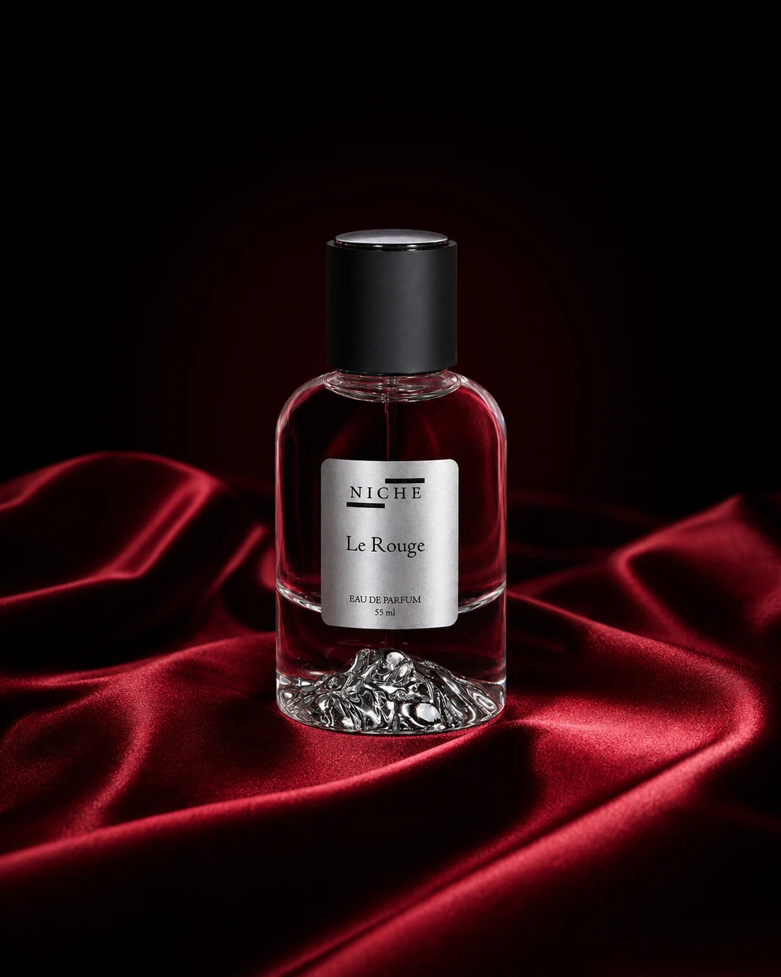 Le Rouge by Niche perfume bottle centered on deep red silk