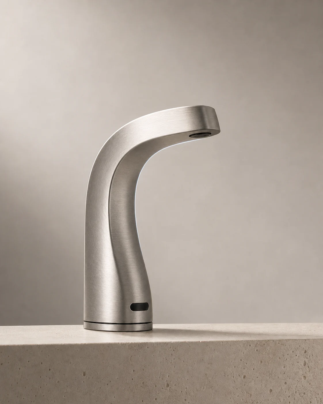 NERAI Arc Flow 01 brushed-nickel faucet standing on a warm architectural basin surface