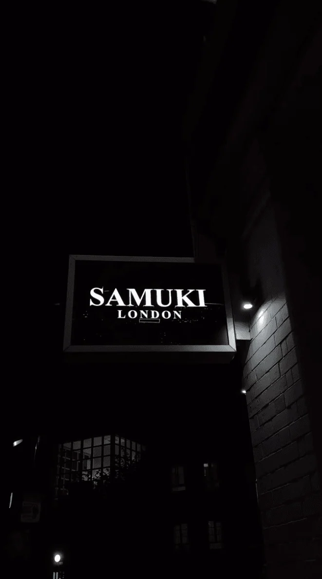 Original Samuki Lounge sign photographed at night