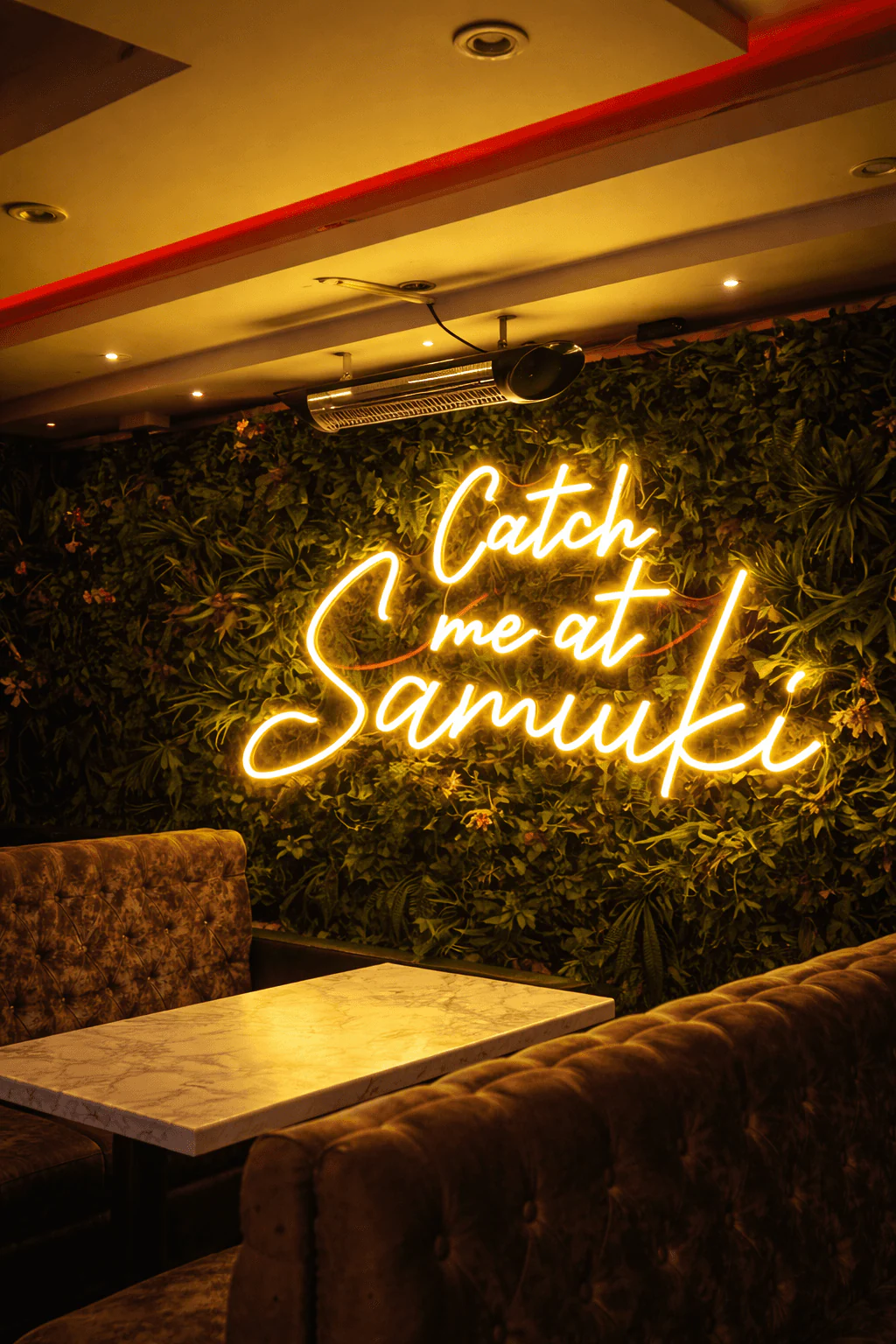 AI-generated Samuki lounge booth beneath the neon sign
